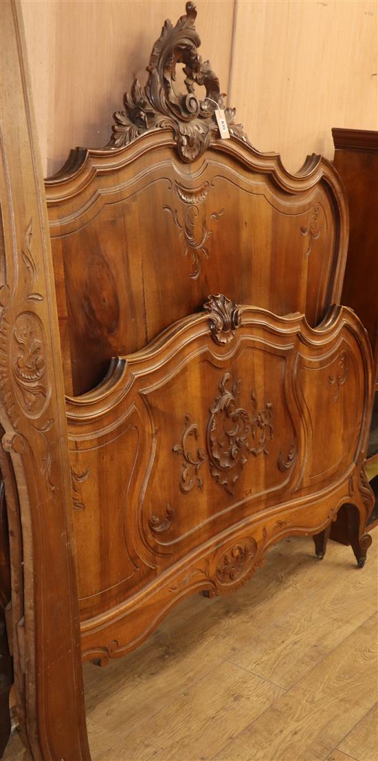 A Louis XV Design carved walnut bedframe 140cm